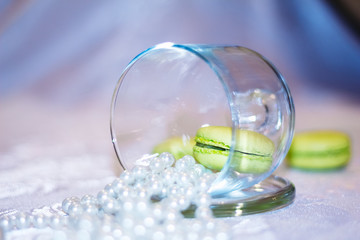 Macarons in a glass jar with beads of pearls