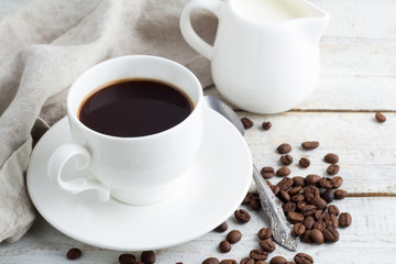 coffee beans and coffee cup on a white background