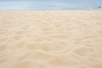 Naklejka na ściany i meble Beautiful sand at the beach close up for background.