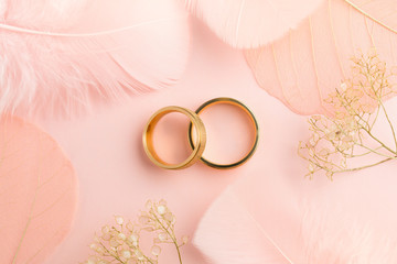 Elegant Love background - two golden rings and decorations