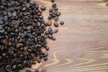 Arabica coffee beans on a black wooden table