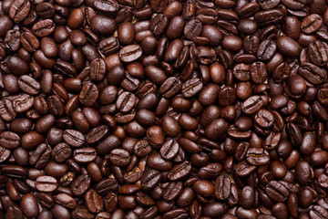 Organic coffee beans in background close up.
