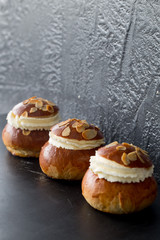 Fresh baked homemade buns on the table for breakfast Baking traditional Swedish semla bread