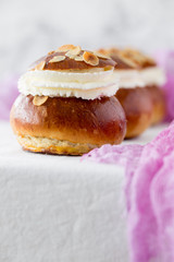 Fresh baked homemade buns on the table for breakfast Baking traditional Swedish semla bread