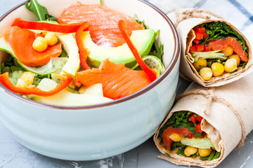 Salad with salmon and chickpeas with wraps for lunch. Love for a healthy food concept