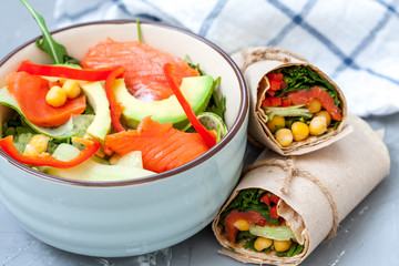 Salad with salmon and chickpeas with wraps for lunch. Love for a healthy food concept