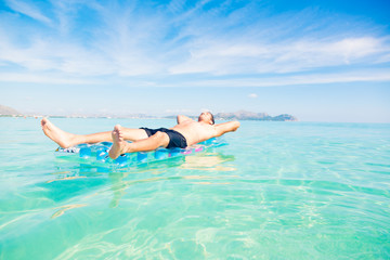 Young Man With Pool Raft