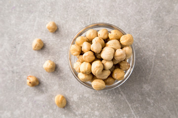 roasted hazelnut in the glass bowl on stone table