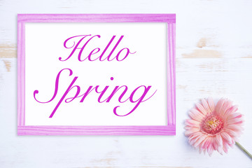 pink flower and frame with words Hello Spring