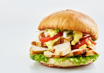 Slices of chicken in tasty burger with cheese