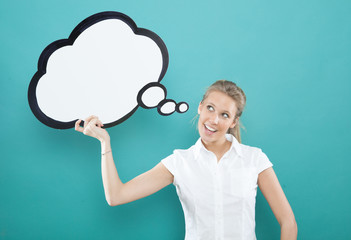 pretty young blond caucasian woman smiling with comic baloon  on blue background