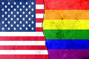 A crack in the wall. Rainbow flag. USA flag.
