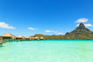 Over water bungalows with steps into amazing green lagoon