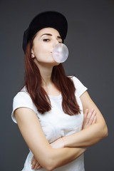 Girl inflates bubble gum