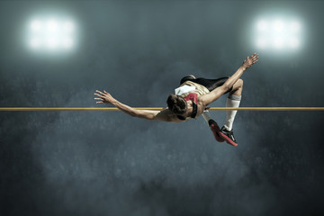 Athlete in action of high jump. - Powered by Adobe