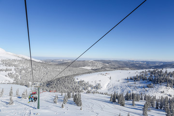 Lovely sunny day on a skilift in the snowy carpathians