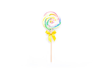 Colorful spiral lollipop candy on white background