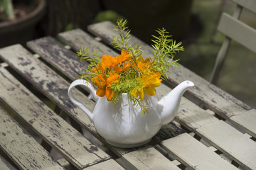 flower on table with natural sun light, vintage tone