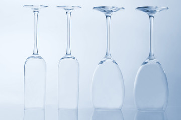 four empty wine glass on a light background