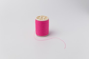 Colorful reel , colorful thread on white background
