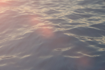 Sea, ocean wave close-up sunset, low angle view, cross processing effect. Hard focus with selective focus. 3d rendering