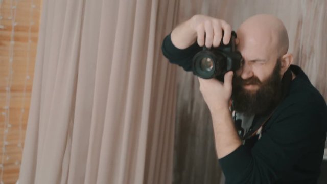 Photographer man working in a photo studio