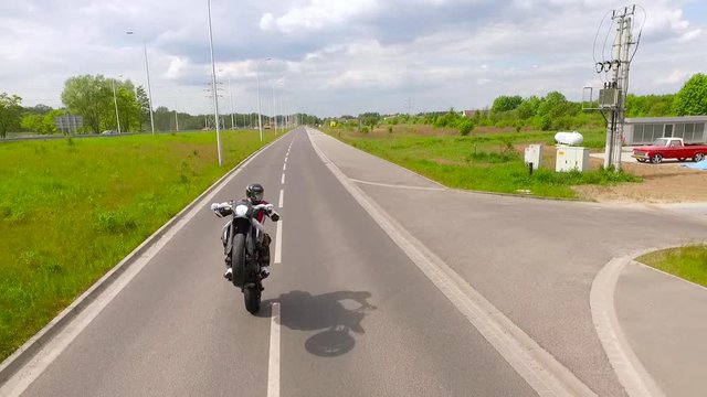 Motorbiker one one wheel