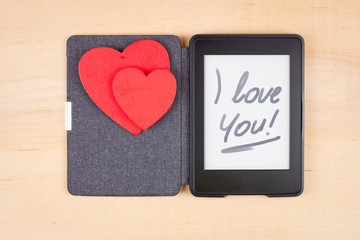 E-book reader with two red hearts and inscription "I love You"