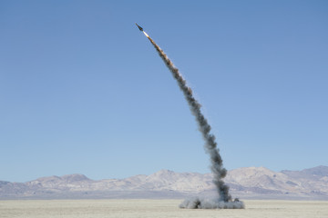 Rocket shooting into vast, desert sky, Black Rock Desert, Nevada, USA