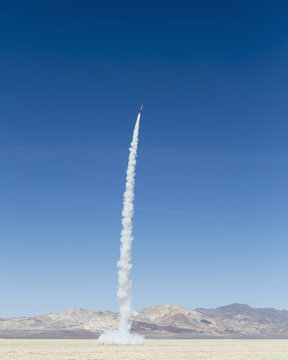 Rocket shooting into vast, desert sky, Black Rock Desert, Nevada, USA