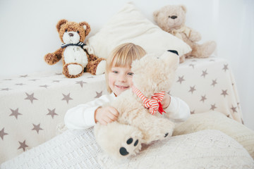 Fototapeta premium Happy little smiling child celebrates Christmas. New Year's holidays.