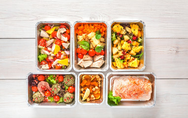 Healthy food take away, top view at wood background