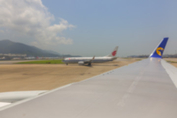 the view  when i am looking through window aircraft during flight to Hongkong and see Hongkong airport .