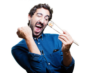 young man eating sushi. all right concept