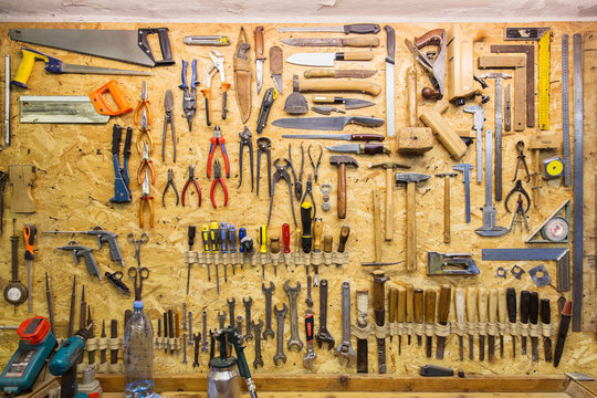 work tools hanging on wall at workshop