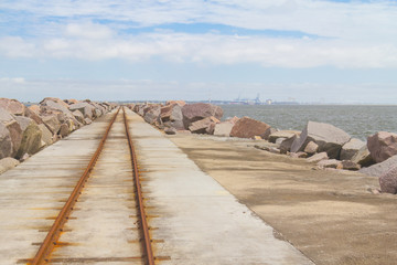 rail over breakwater at Cassino beach