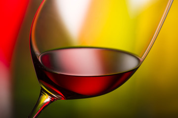 glass with red wine bottle