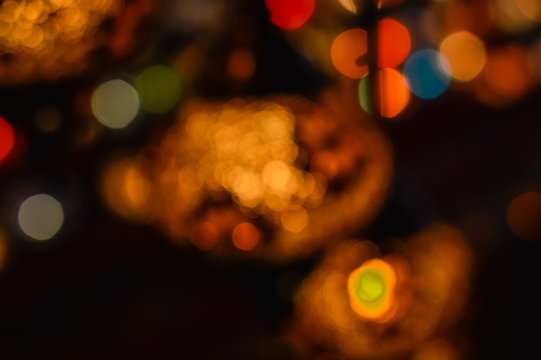 Colorful blurry shiny background of illuminated beautiful lighting lamps, closeup view