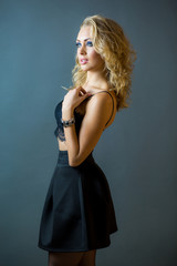 Fototapeta premium Beautiful sexy young blonde girl model with makeup and perfect body