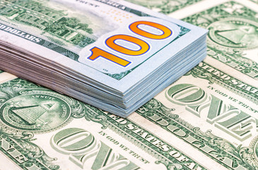 Heap of one hundred banknotes of american dollars close up