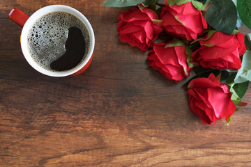 Black coffee on a wooden table with a red rose for encouragement, hope, happiness, impressed, friendship concept