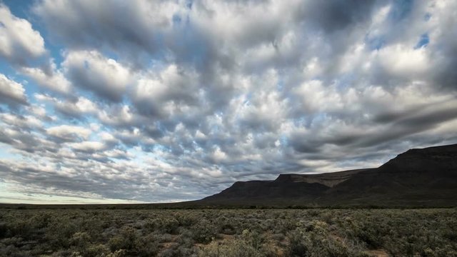 Desert with cloudy sky timelapse