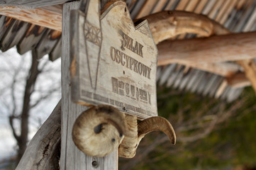 Wooden board in Tatra Mountains, Poland "Smoked Cheese Trail" © Wiktoria Matynia
