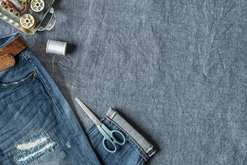 Top View of Jeans and Sewing Tools with Copy Space 