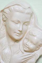 Ceramic sculpture of a mother and child.