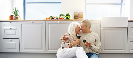 Elderly couple on a kitchen floor