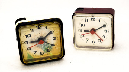 two alarm clock square shape on a light background