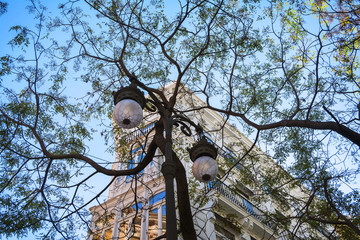 Outdoor background with building ,trees and blue sky ,in the center of Valencia, Spain