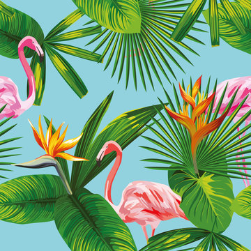 pink flamingo tropical leaves and flowers seamless blue backgrou