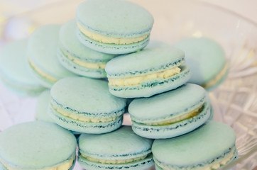 Beautiful blue macarons on glass plate